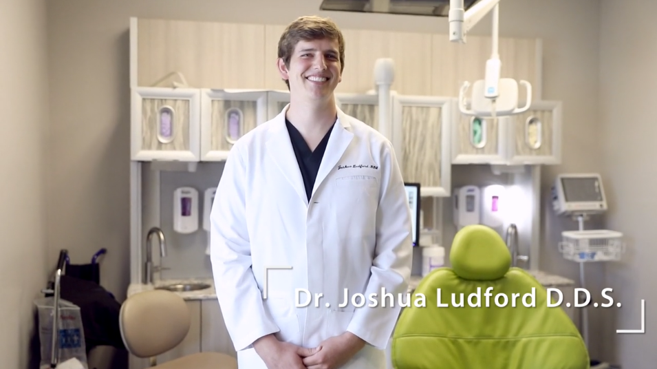 Dr. Joshua Ludford, D.D.S. stands in an Arkansas Family Dental exam room in Little Rock, AR.