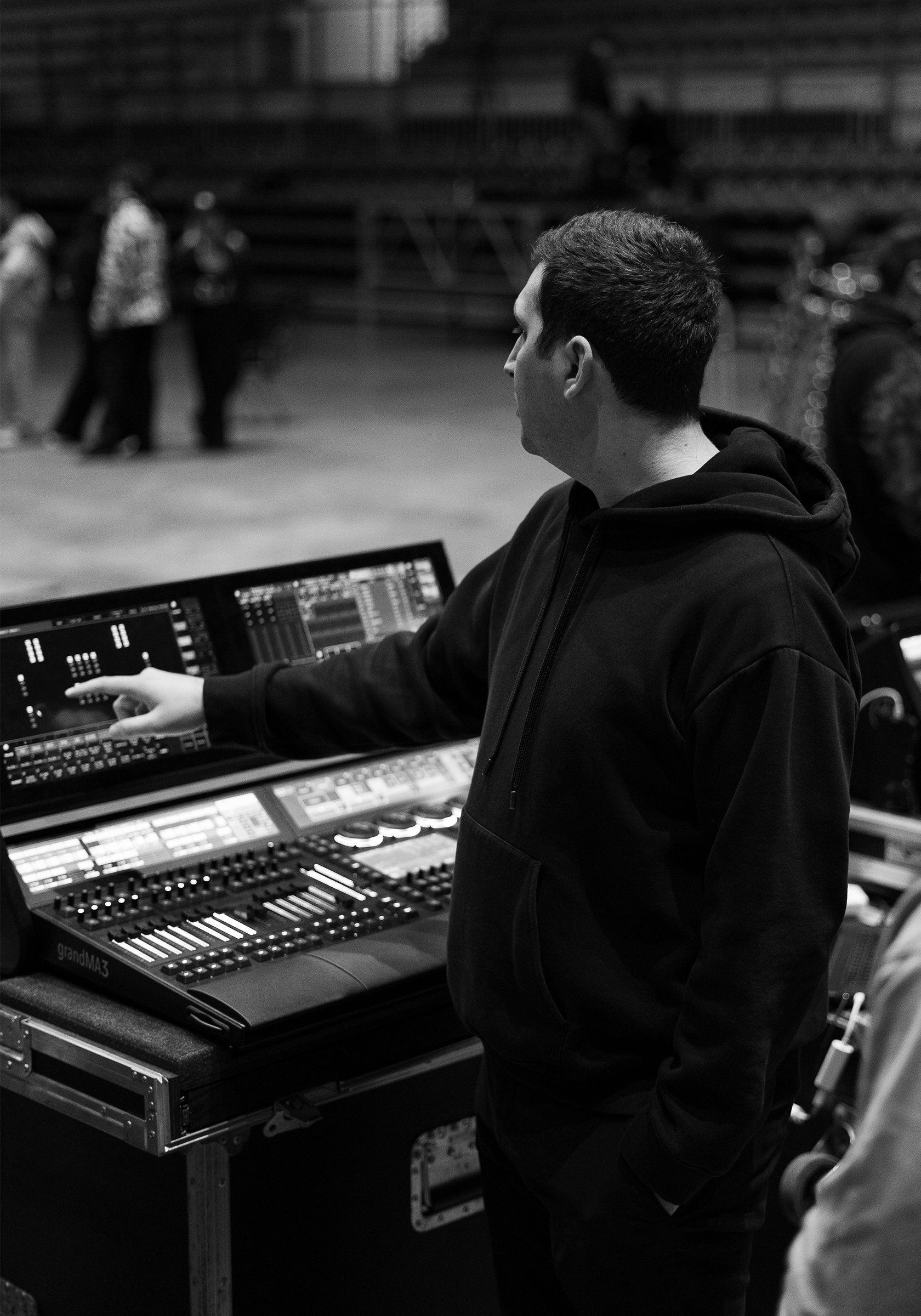 A woman sitting at a table with a laptop.