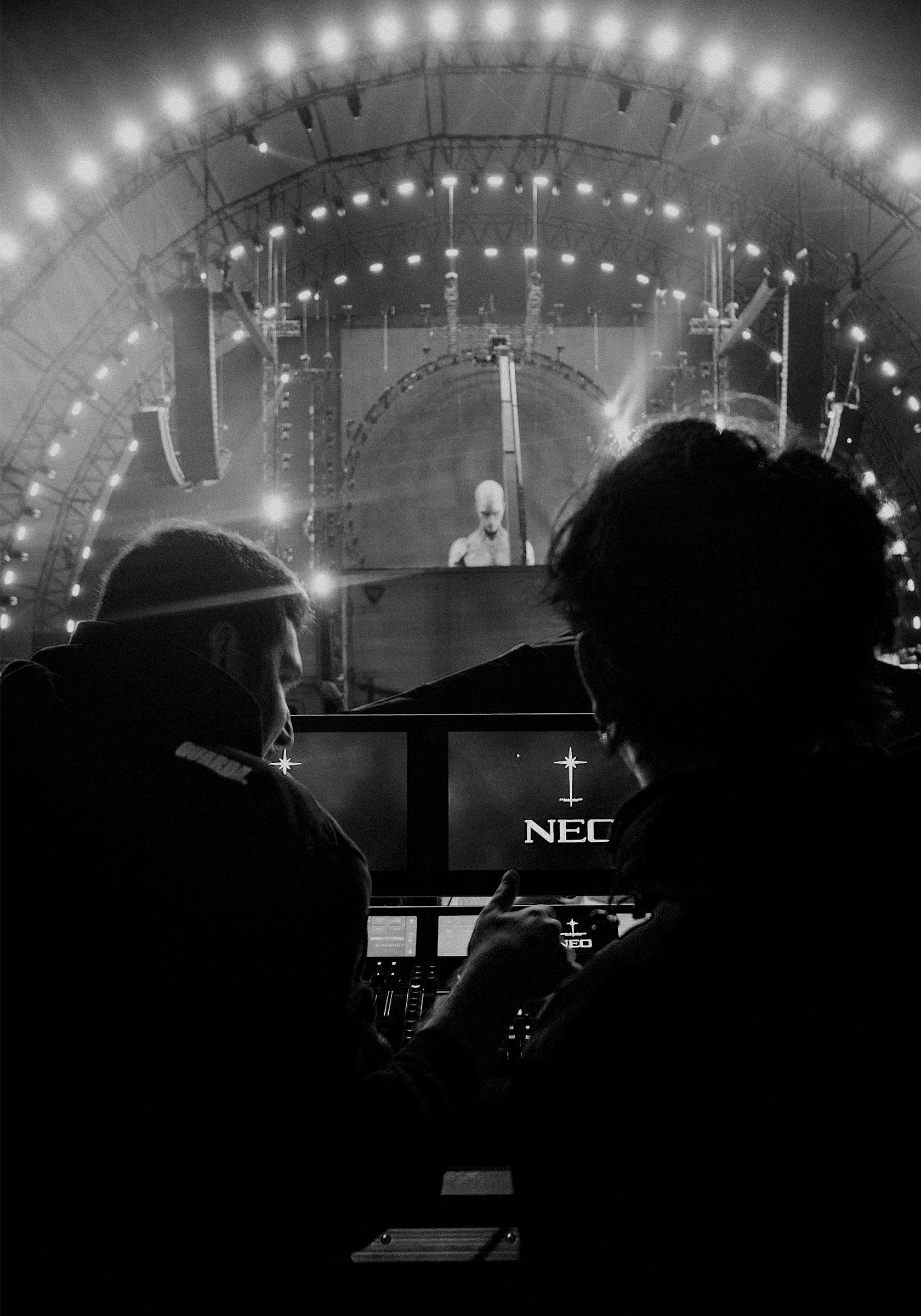 A couple of people sitting on a couch in a room.