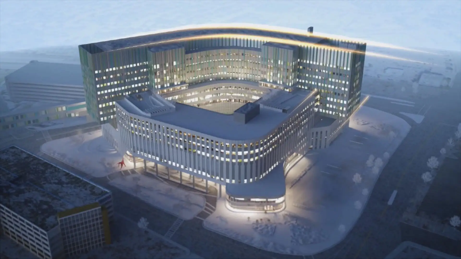 Modern illuminated architectural building with curved glass and geometric design