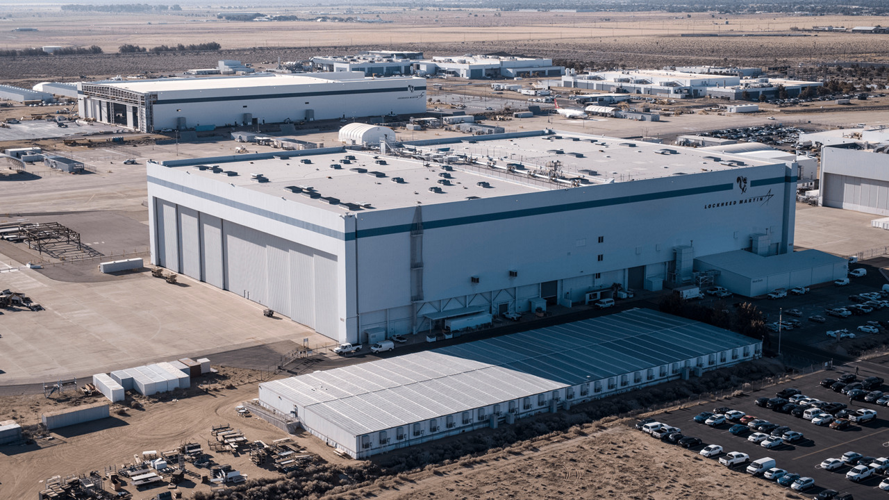Lockheed Martin facility with large white buildings in desert landscape
