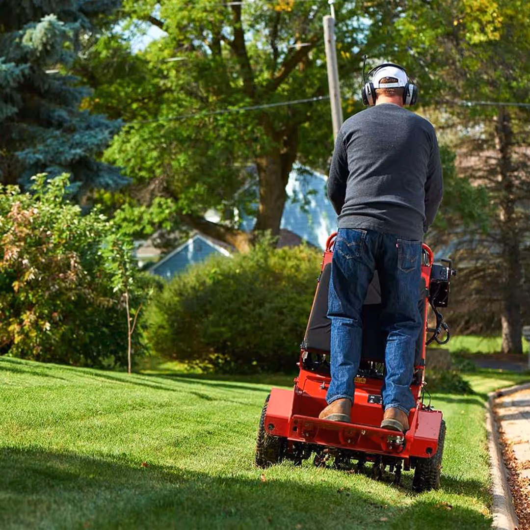 Eden Landscaping LLC worker providing lawn aeration service in Charlotte