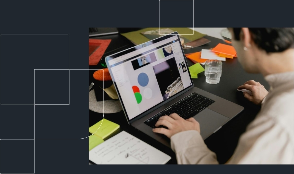 A person using Figma on a laptop.