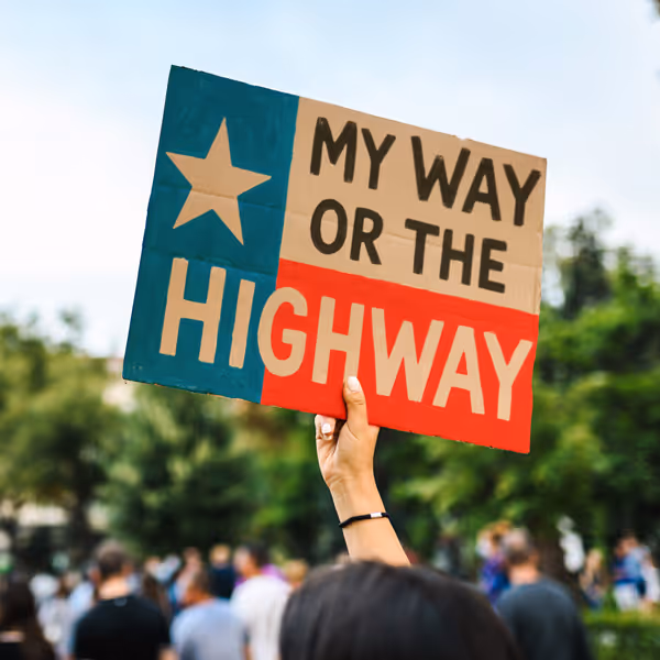 A protester sign that says My Way Or The Highway