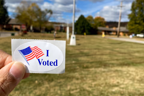 A close up photo of an I Voted sticker