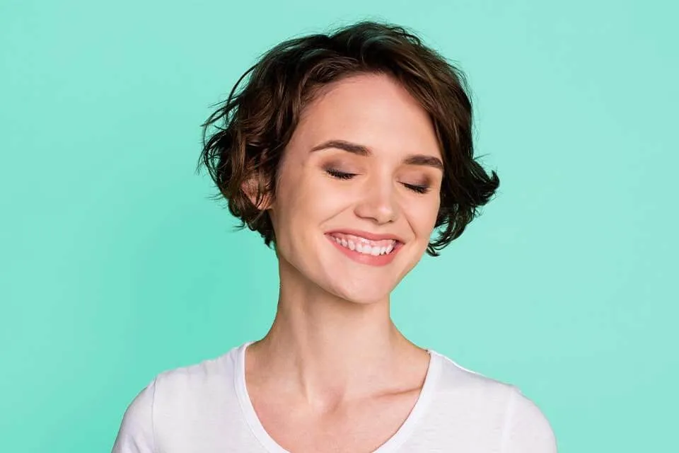 A woman with a smile on her face.