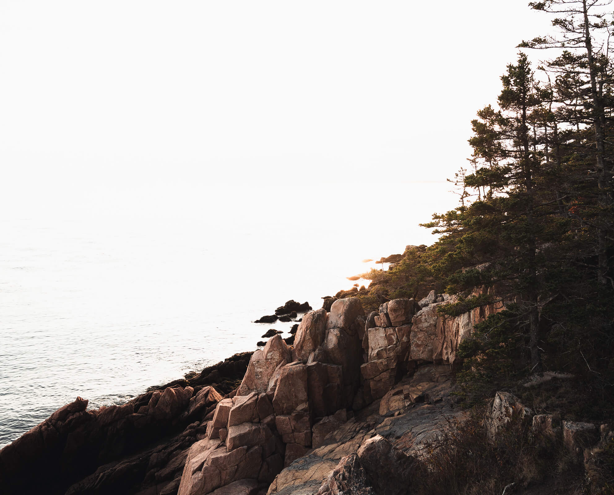 Rocky Maine coastline at sunrise, symbolizing Cornerstone Financial Planning’s trusted guidance in Portland, ME & Portsmouth, NH.