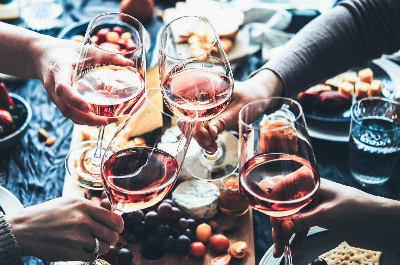 Friends celebrating with wine, reflecting meaningful financial planning for life’s milestones and relationships.