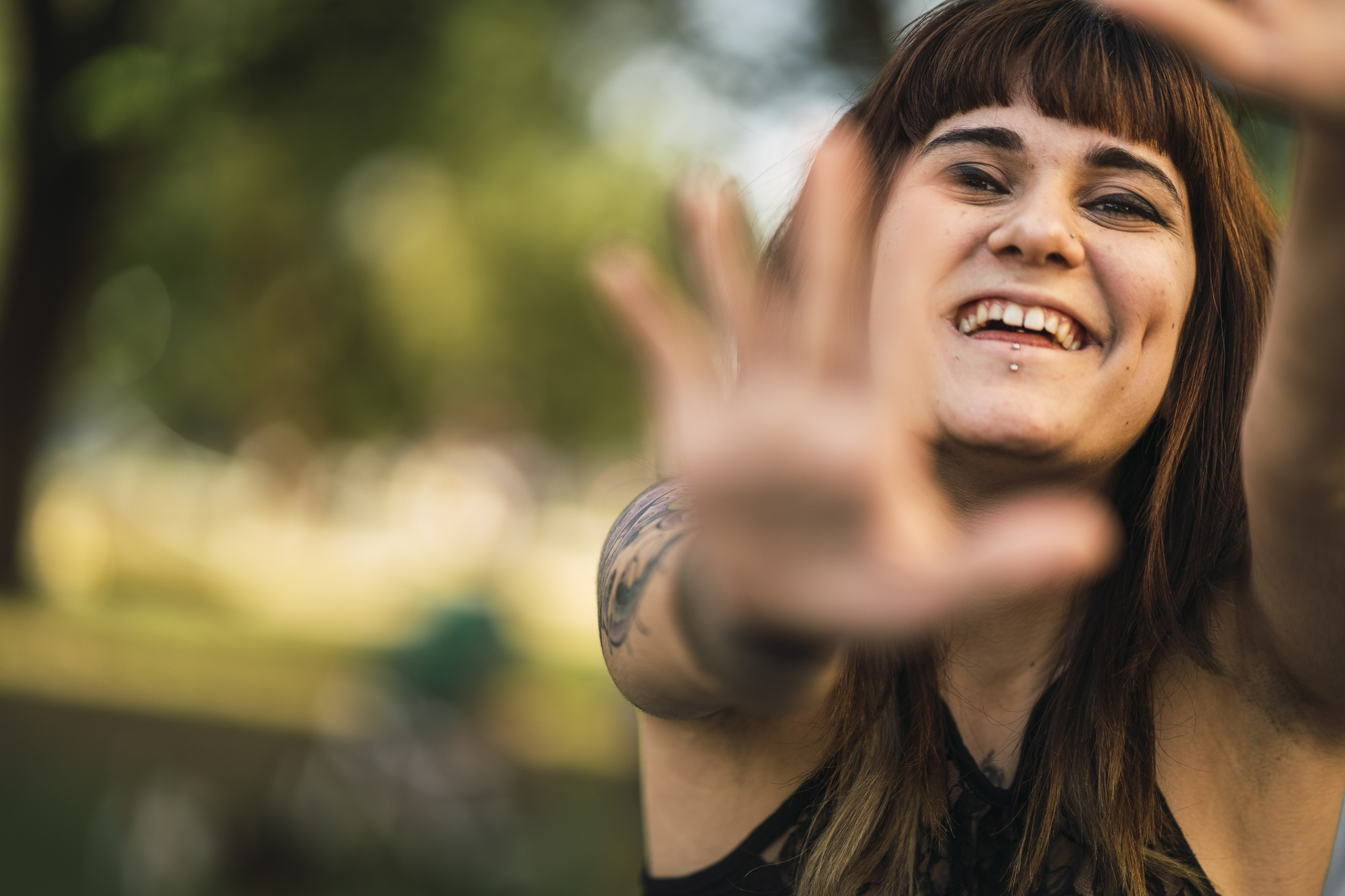 Young woman in addiction recovery enjoying time outdoors, representing progress and healing during outpatient treatment.