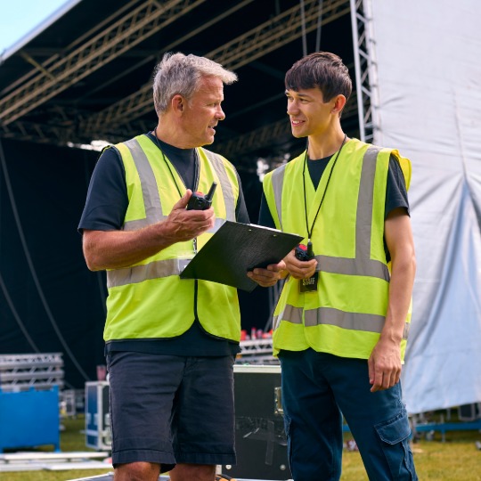 image of fundraising event (for a humanitarian aid nonprofit) - event participants engaging with charity booths