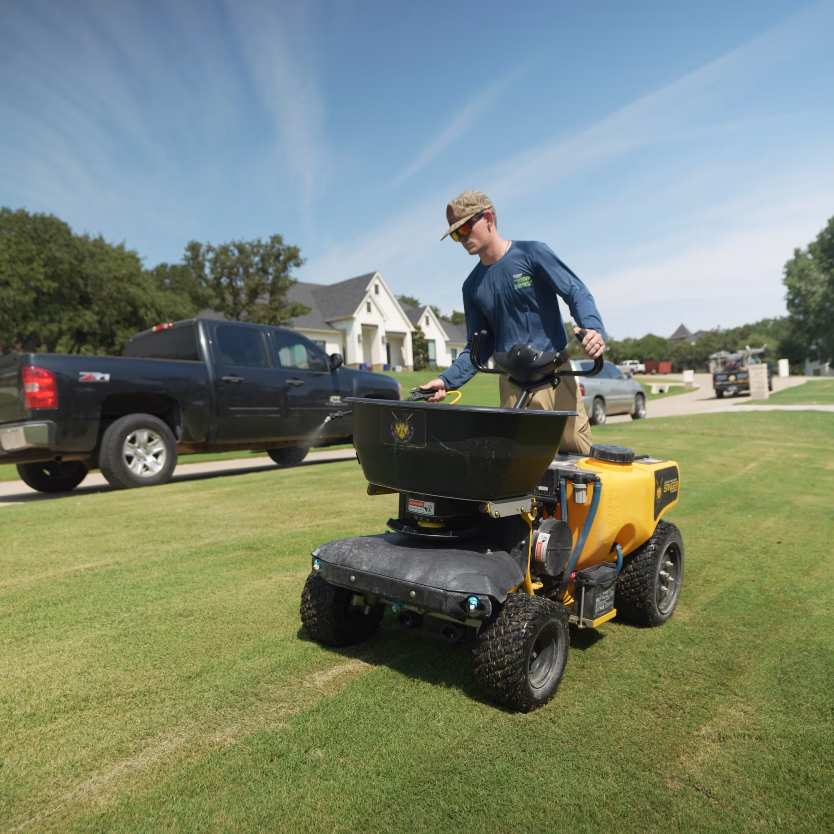 lawn care spreader on a green lawn 