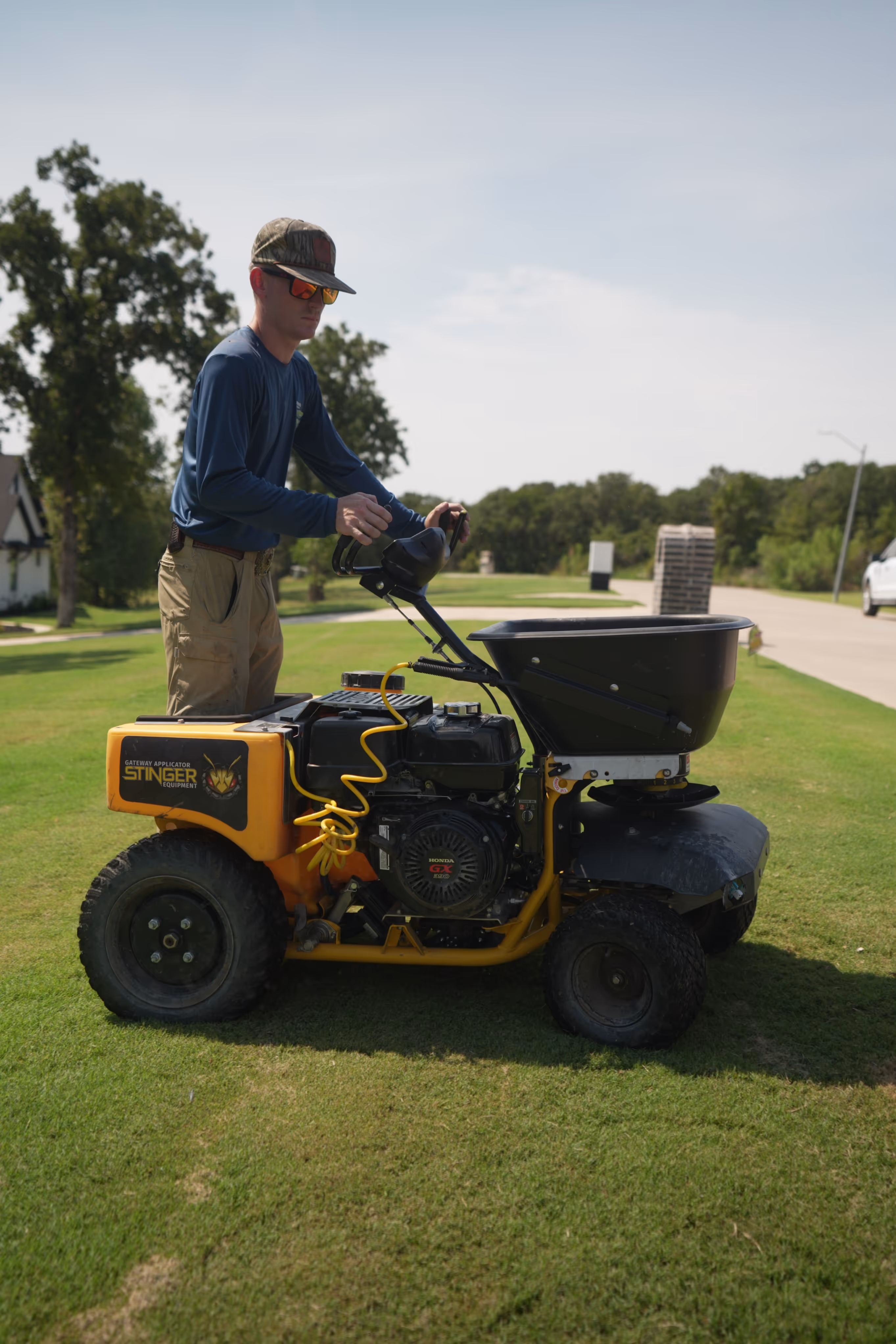 Stinger equipment lawn applicator on a grassy lawn.