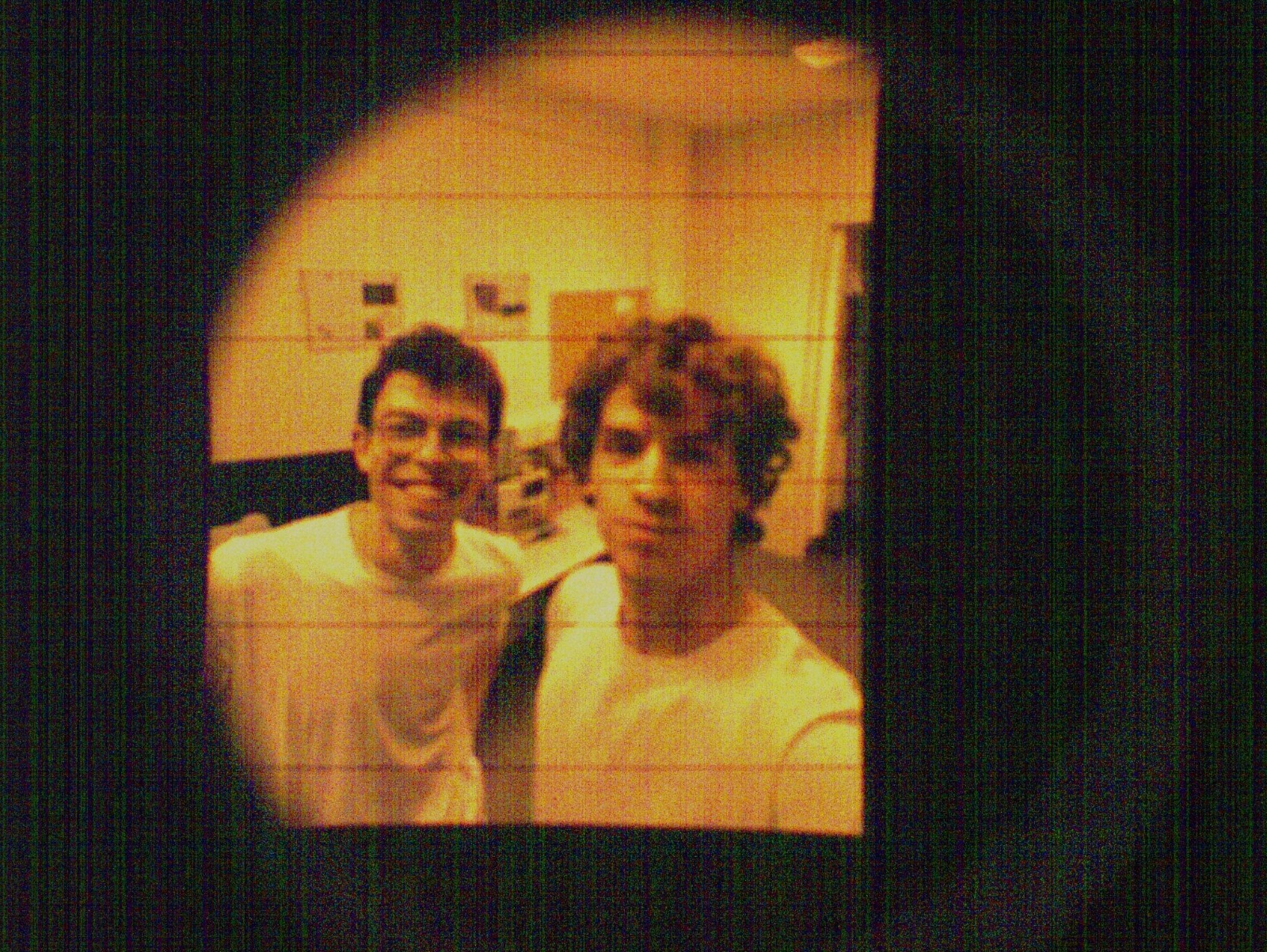 image of engineers working on satellite components [team]