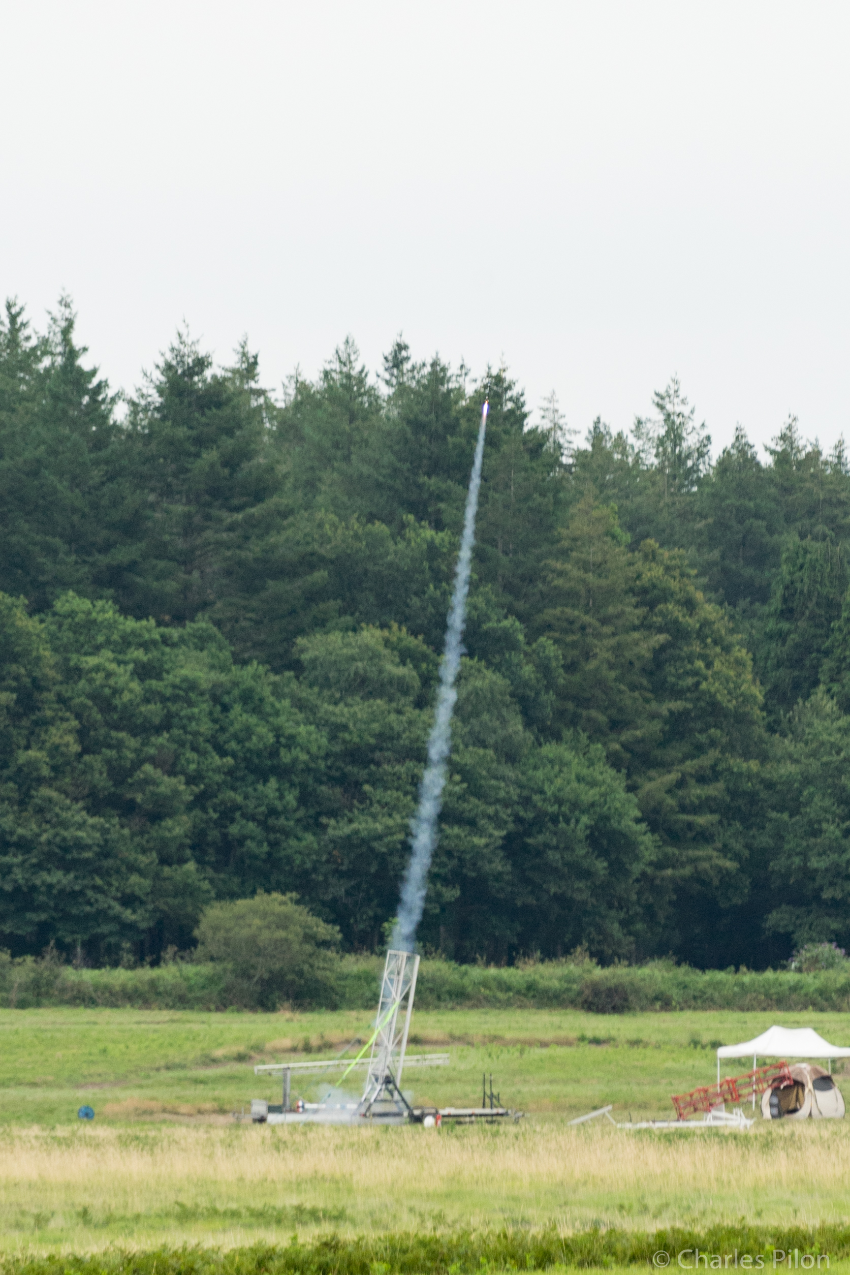 image of engineers working on satellite components [team]
