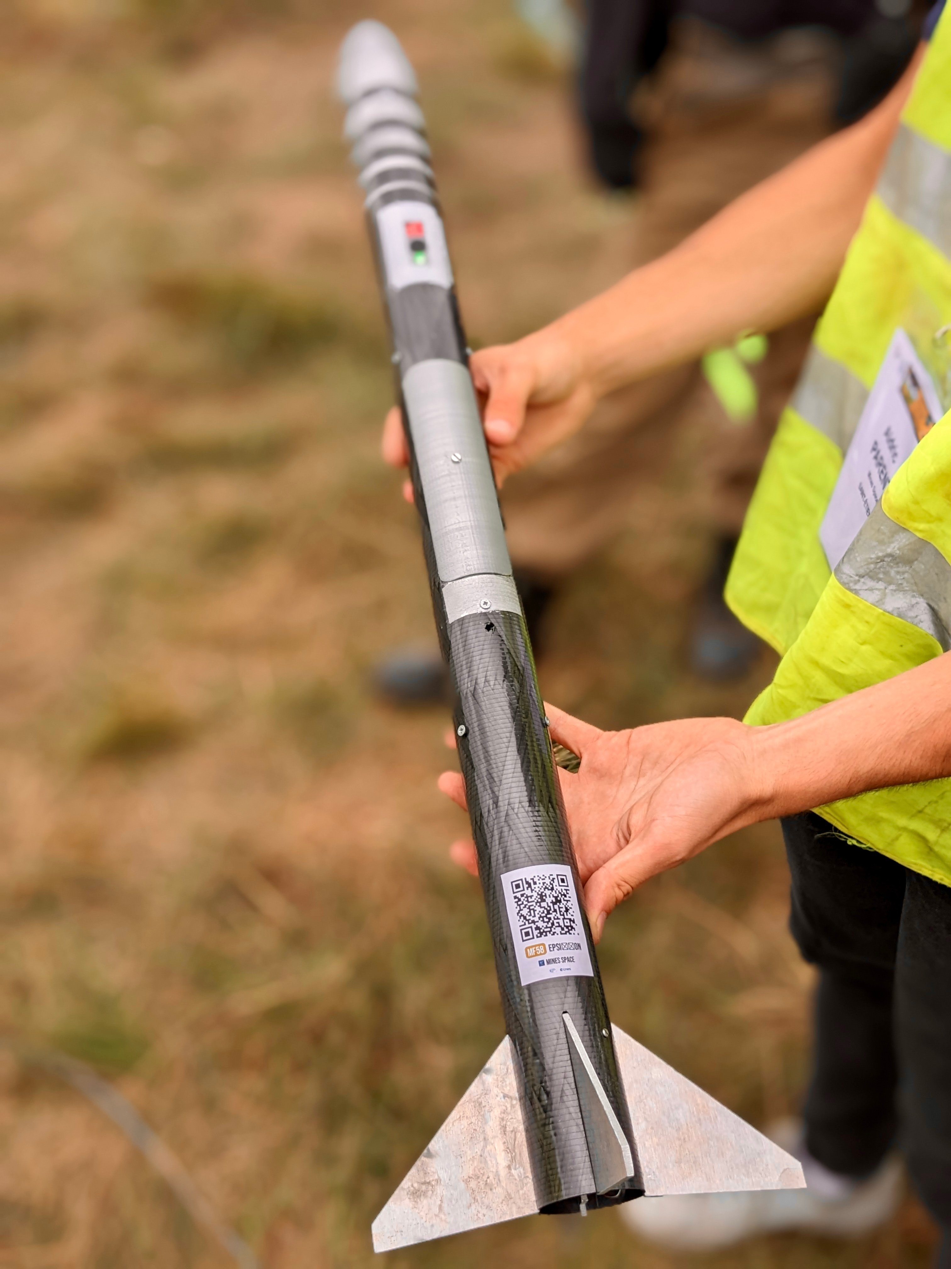 image of engineers working on satellite components [team]
