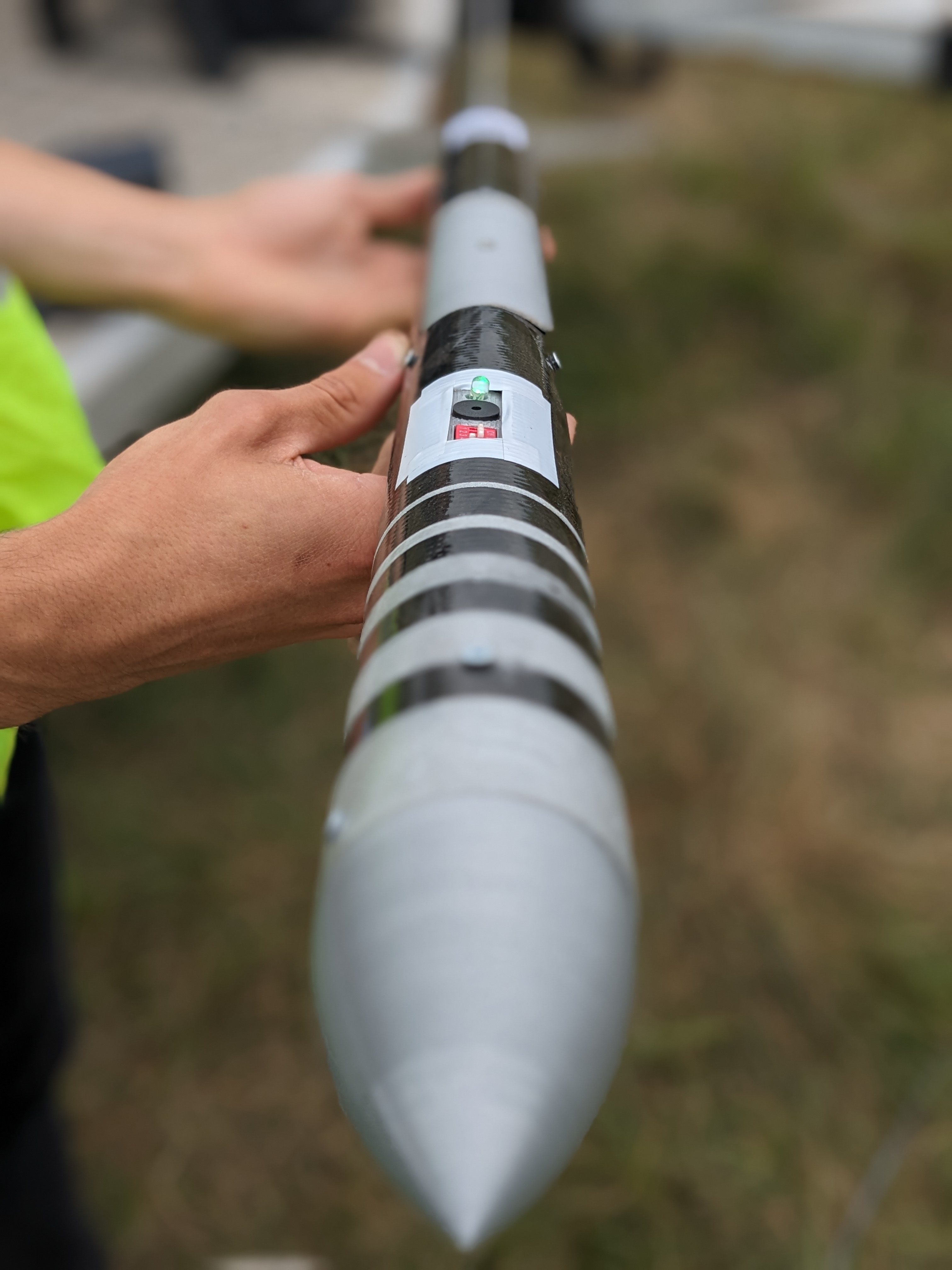 image of engineers working on satellite components [team]