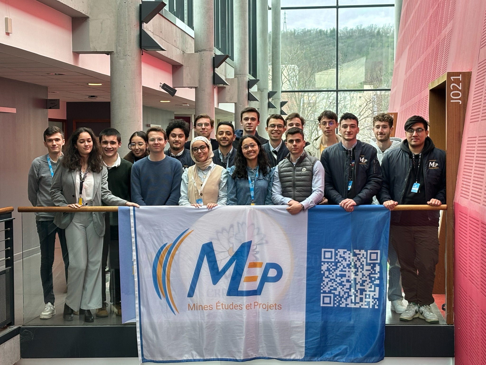 image of engineers working on satellite components [team]