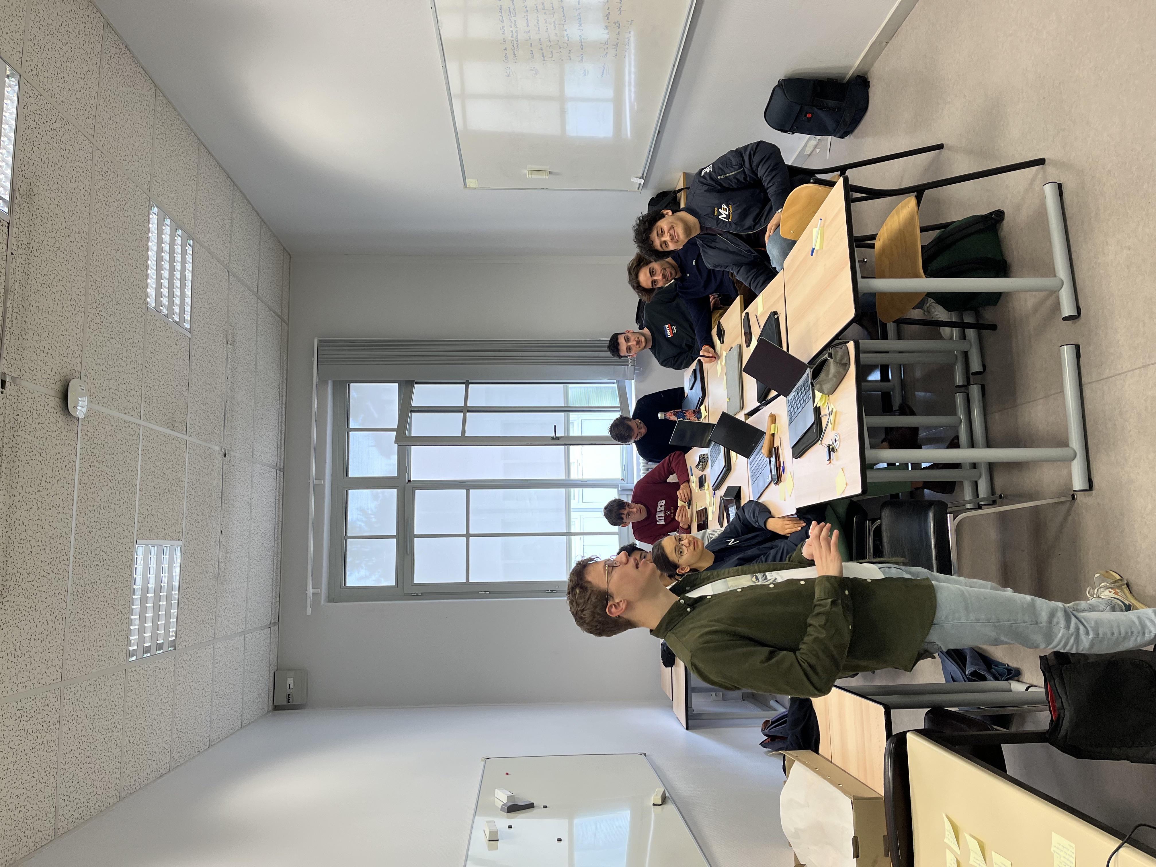 image of engineers working on satellite components [team]