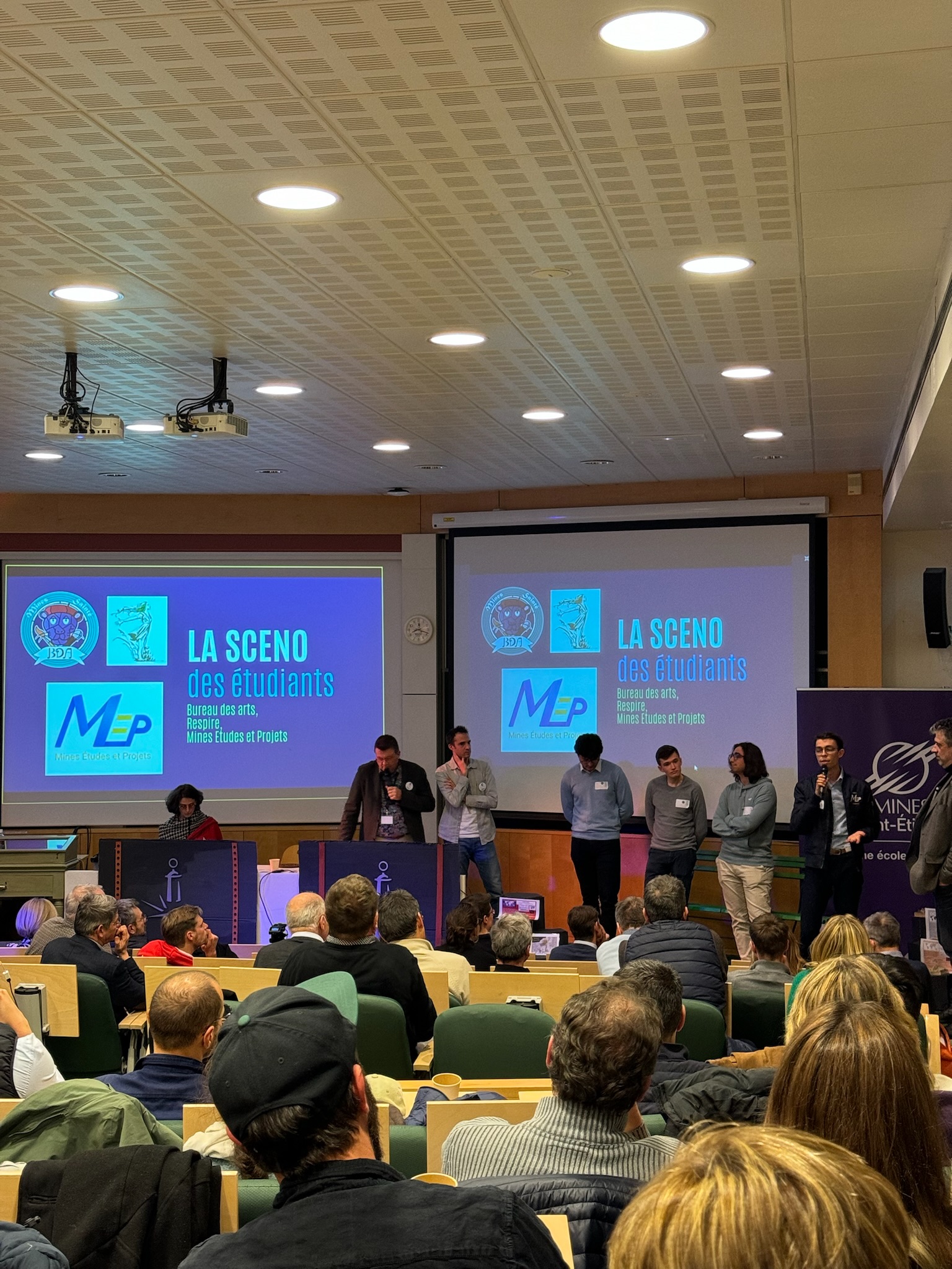 image of engineers working on satellite components [team]