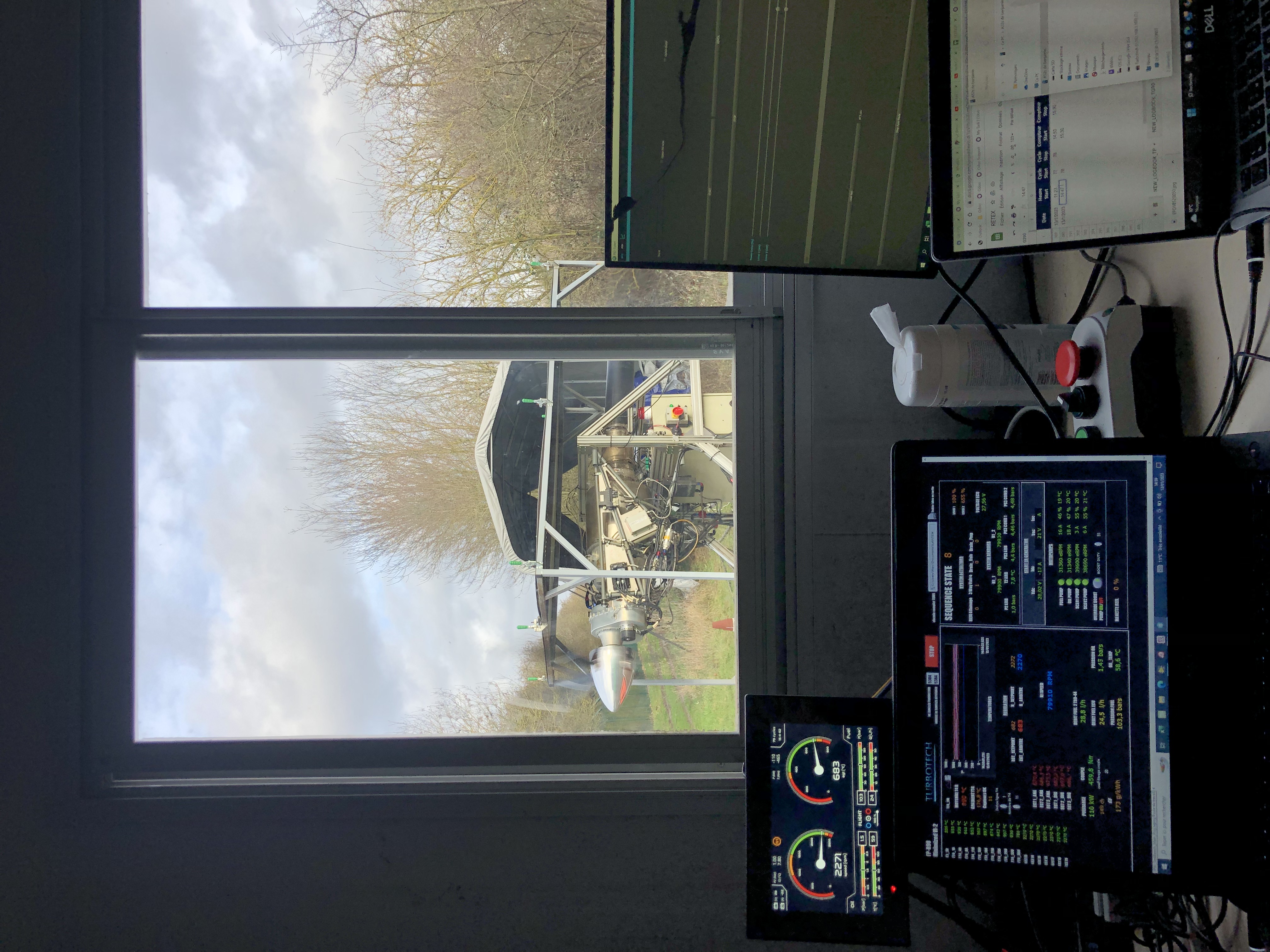 image of engineers working on satellite components [team]