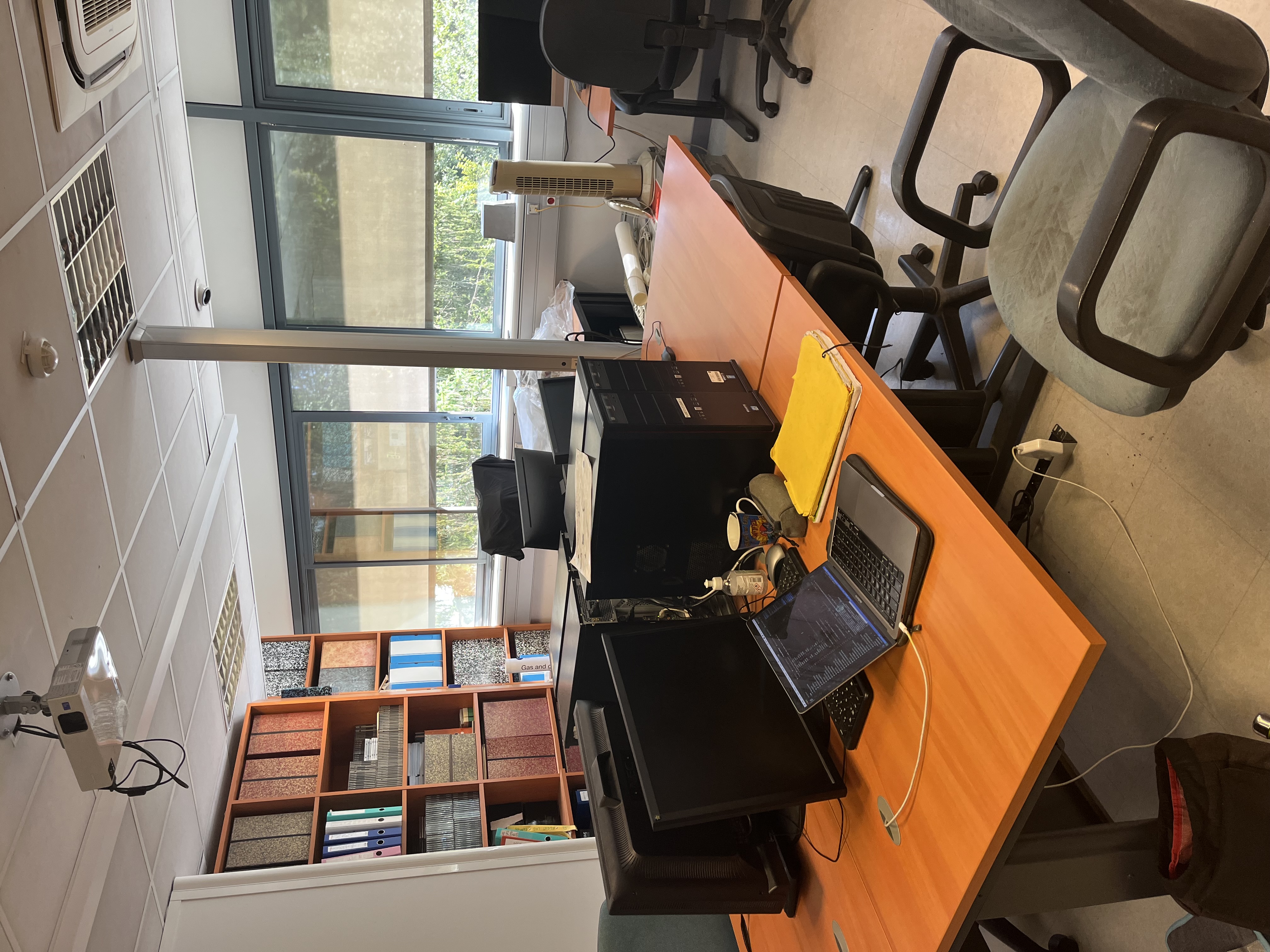 image of engineers working on satellite components [team]