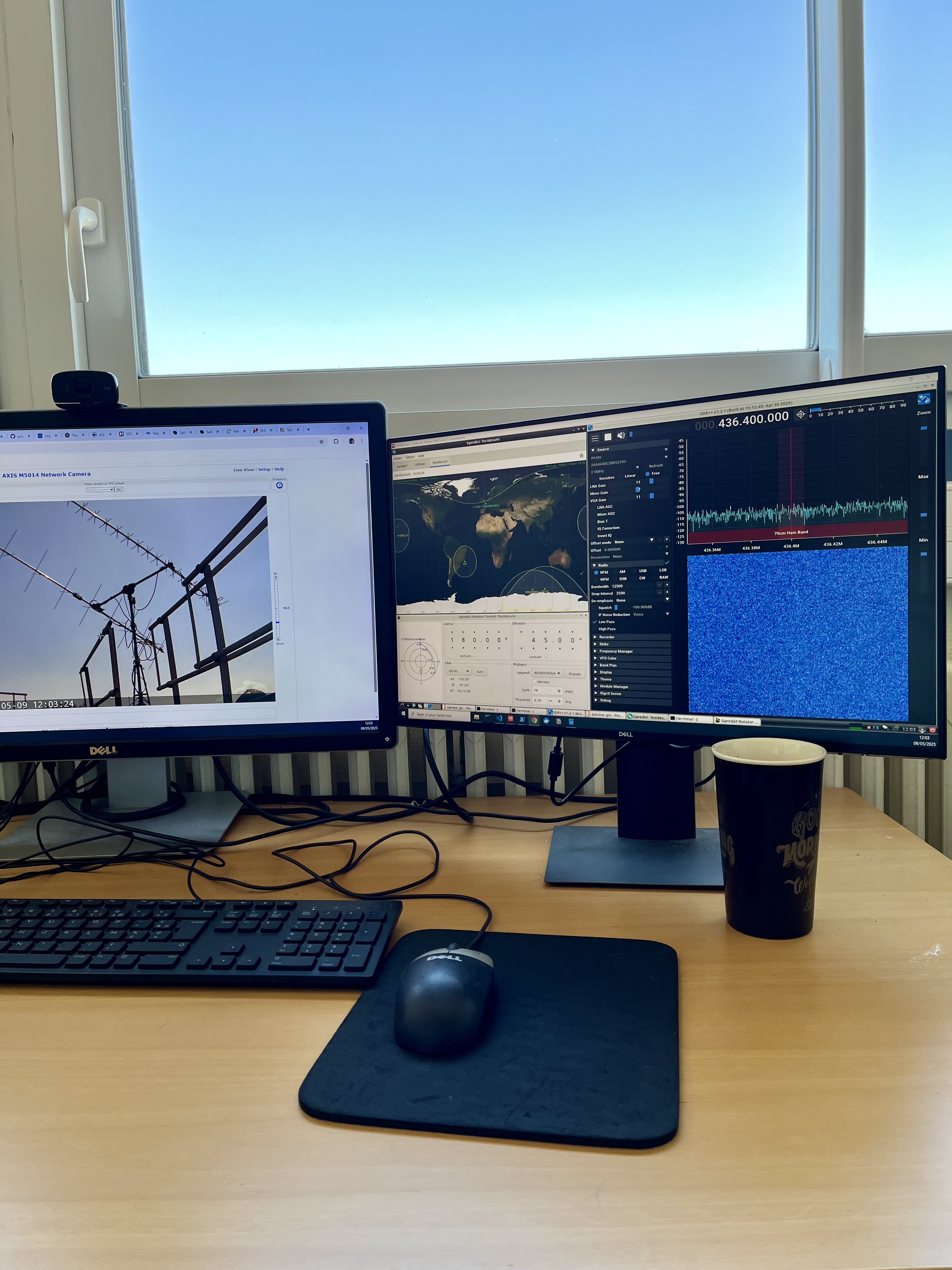 image of engineers working on satellite components [team]