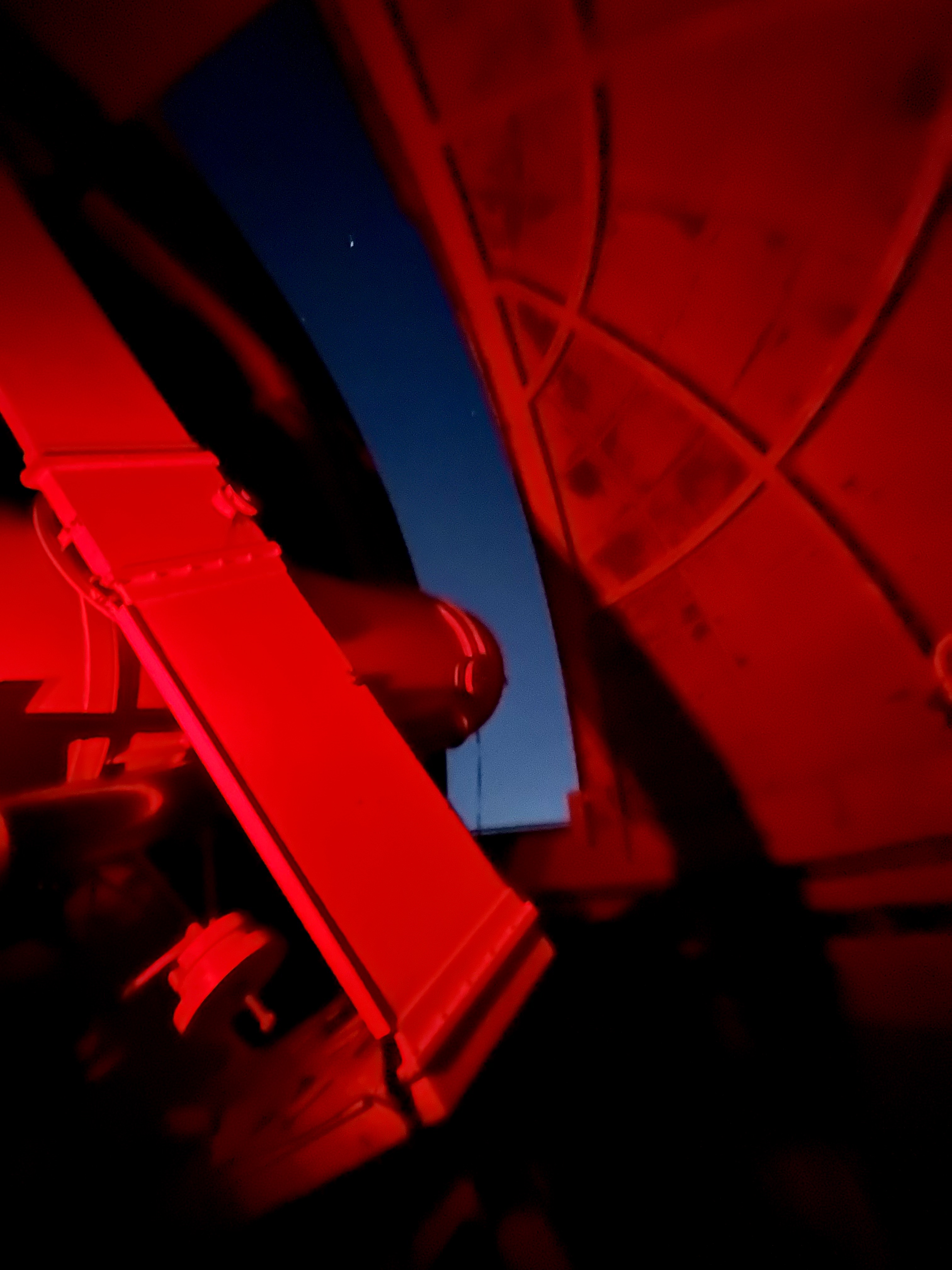image of engineers working on satellite components [team]