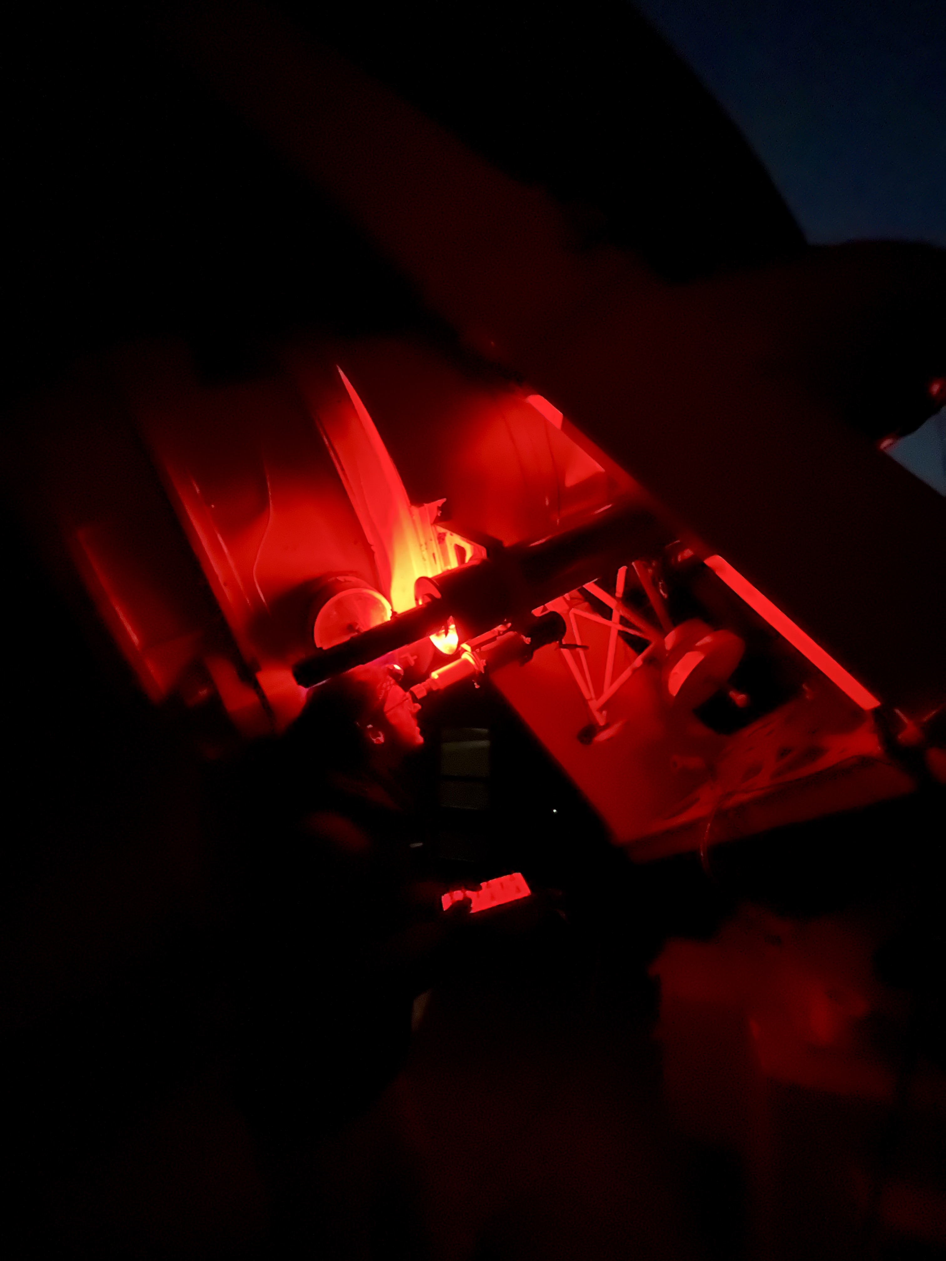 image of engineers working on satellite components [team]