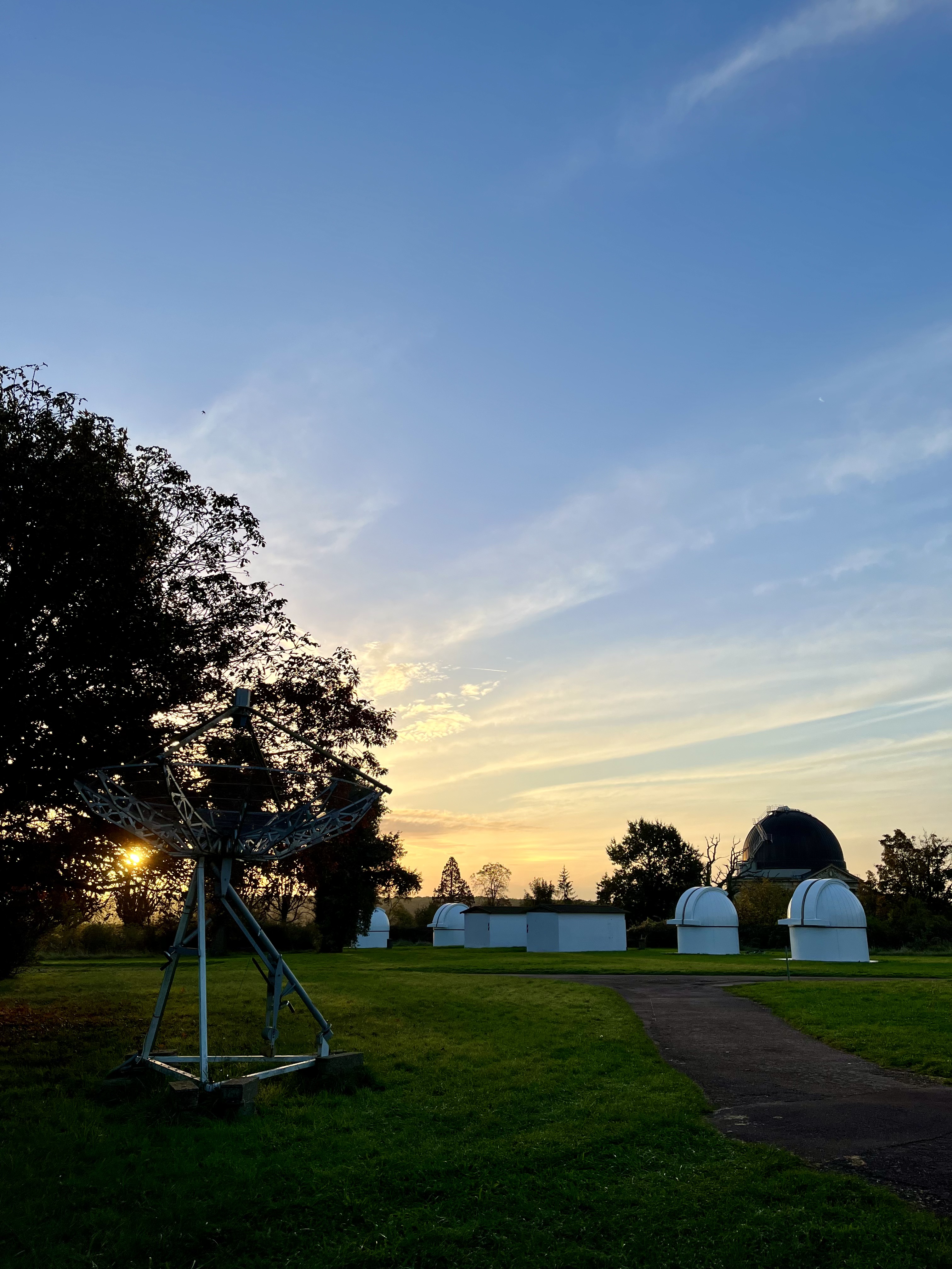 image of engineers working on satellite components [team]
