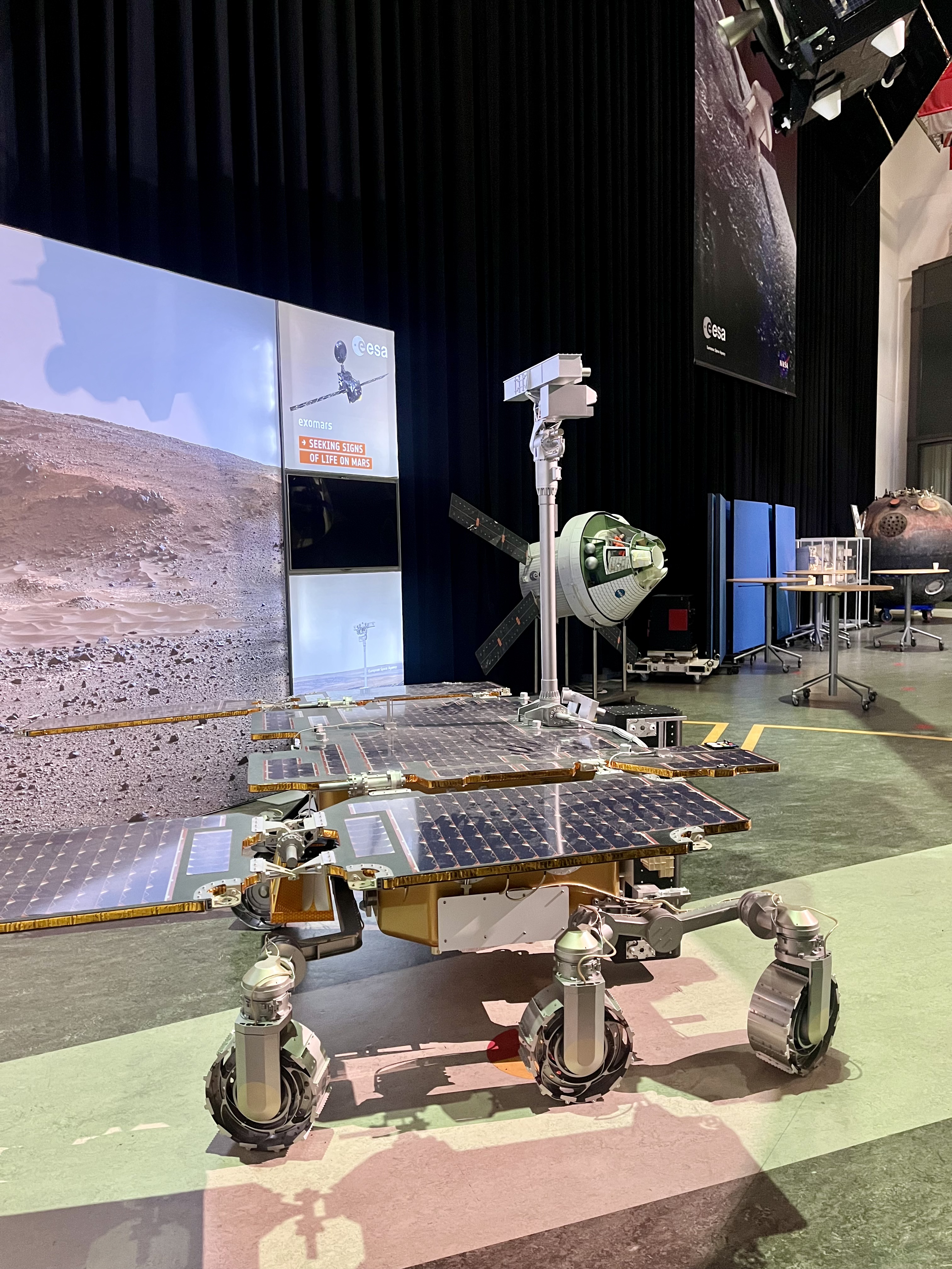 image of engineers working on satellite components [team]