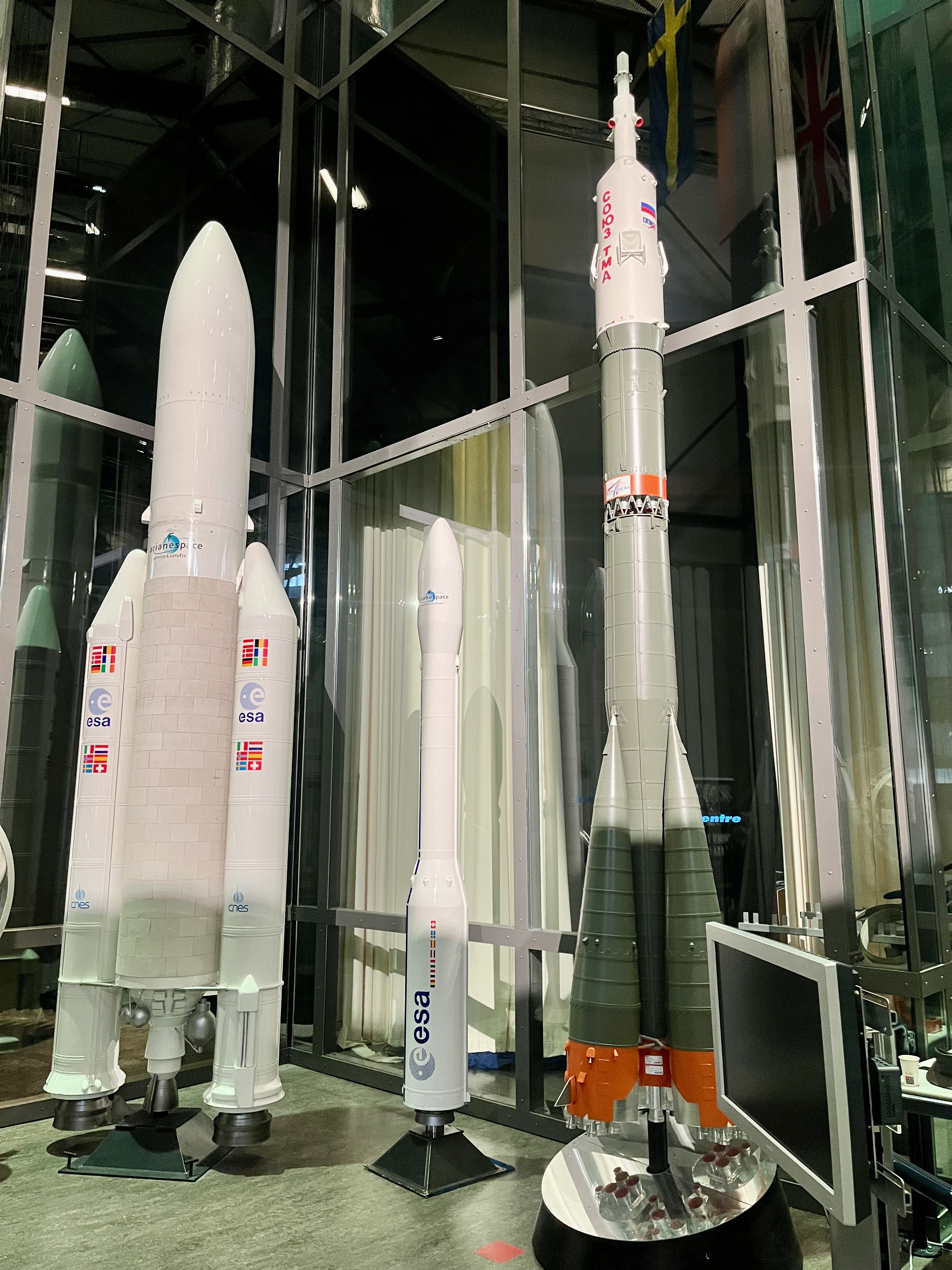 image of engineers working on satellite components [team]