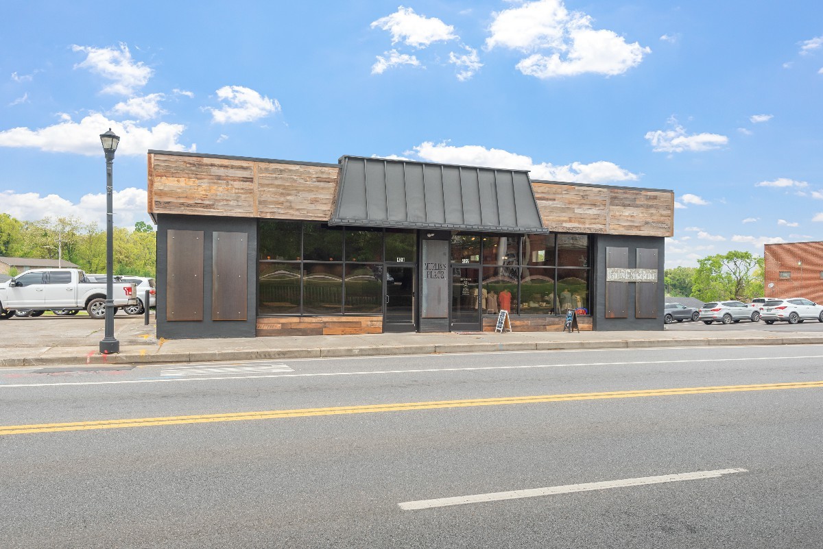 An urban commercial transformation that blends raw industrial elements with modern functionality to create a vibrant, community focused space.