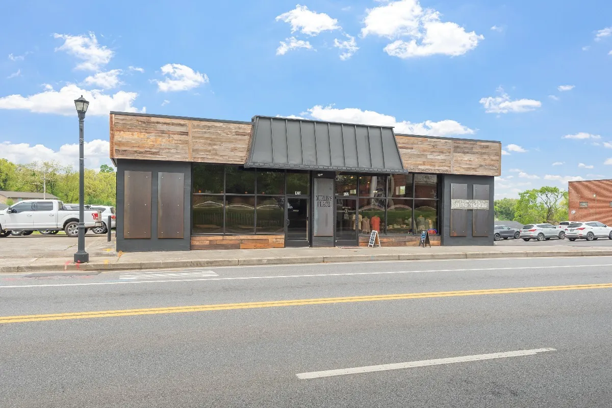 An urban commercial transformation that blends raw industrial elements with modern functionality to create a vibrant, community focused space.