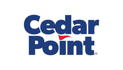 Cedar Point logo with blue text and a small red flag above the letter 'i'.