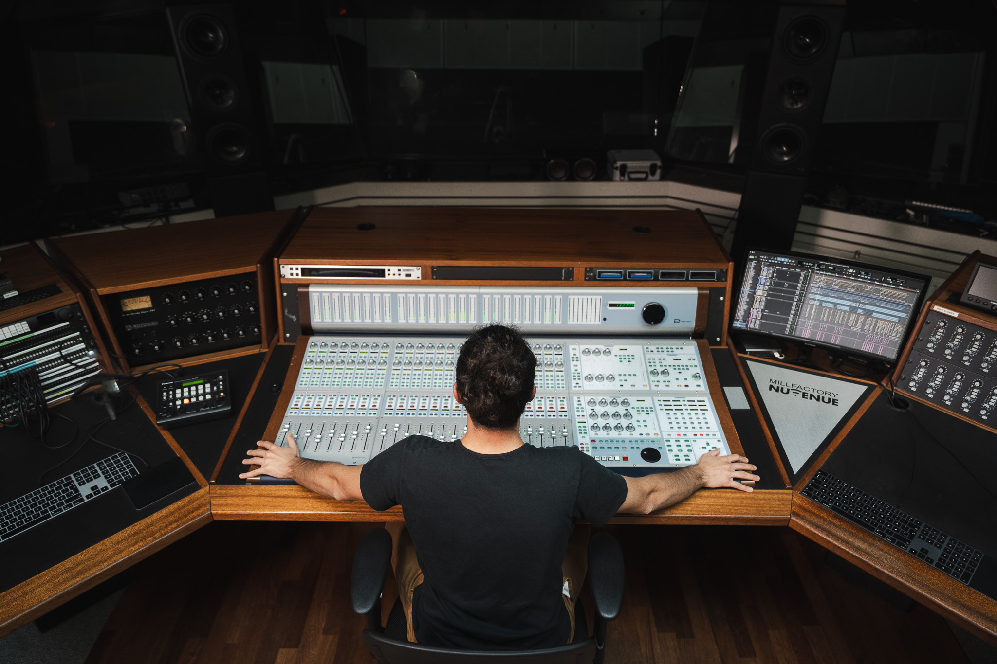 moody studio scene with music producer