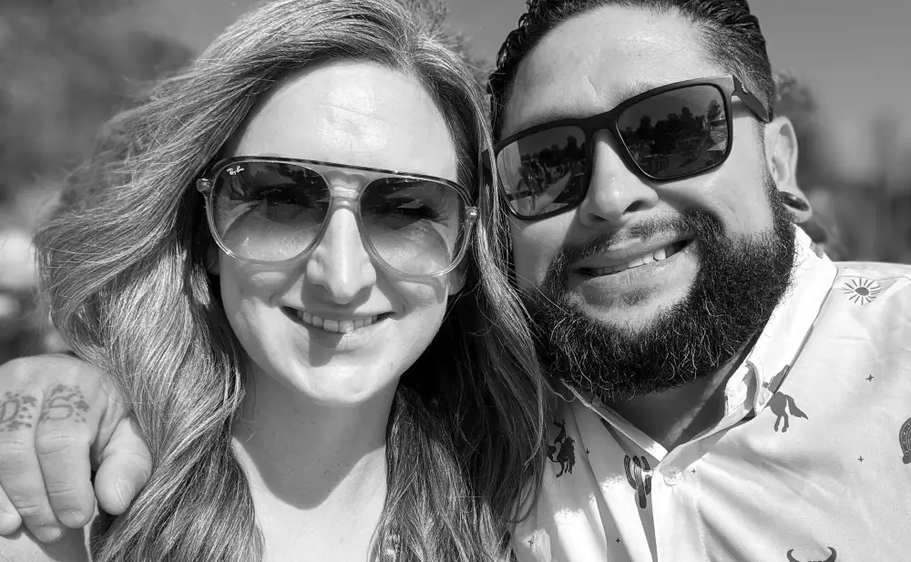 Becky and Steve, founders of Ember + Spice, smiling together as they share their passion for food and community.