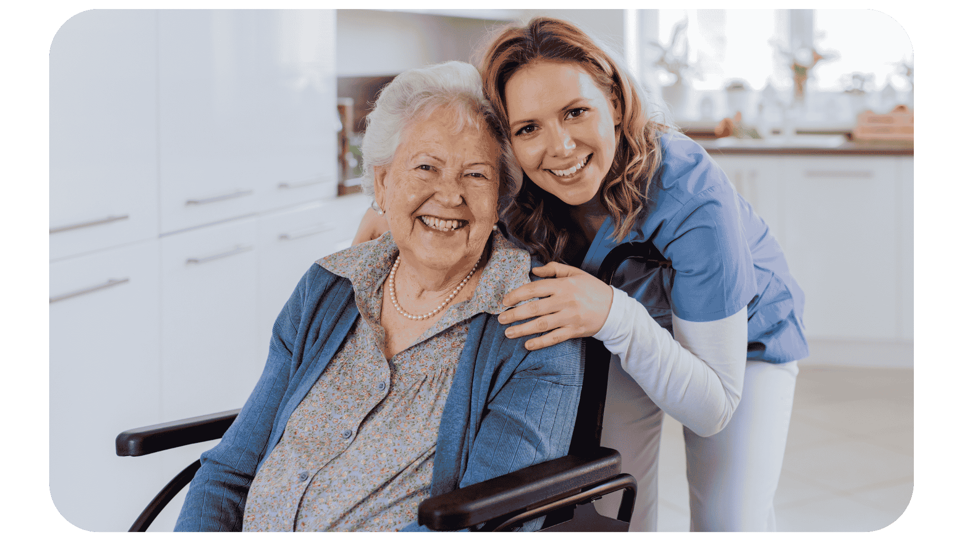 An image of an elderly and and her carer. 