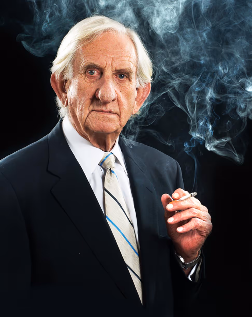 The late David Mattingly, Director at  Wilson Everard, smoking a dart.