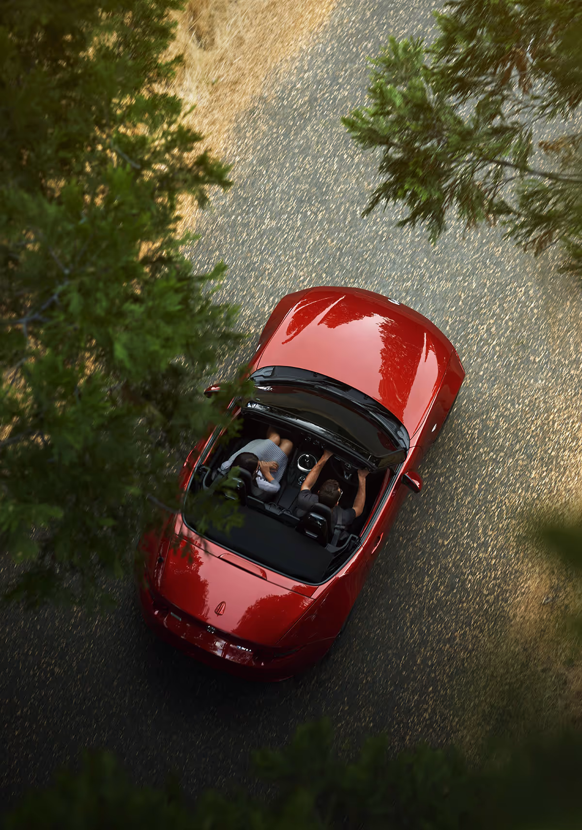 An MX5 Mazda driving on the road