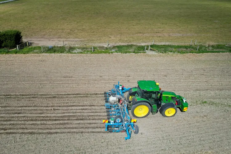 Aerial of Tractor precision GPS drilling seed in paddock