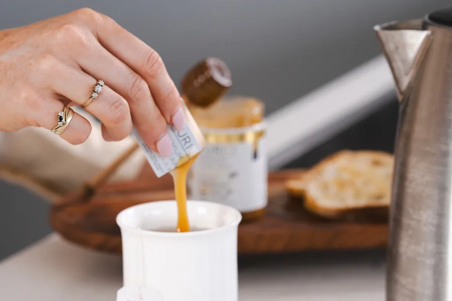 Manuka Snap being snapped into a cup of tea