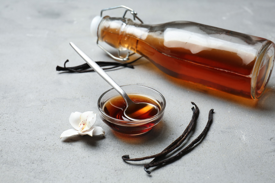 Vanilla in a small glass bowl and bottle