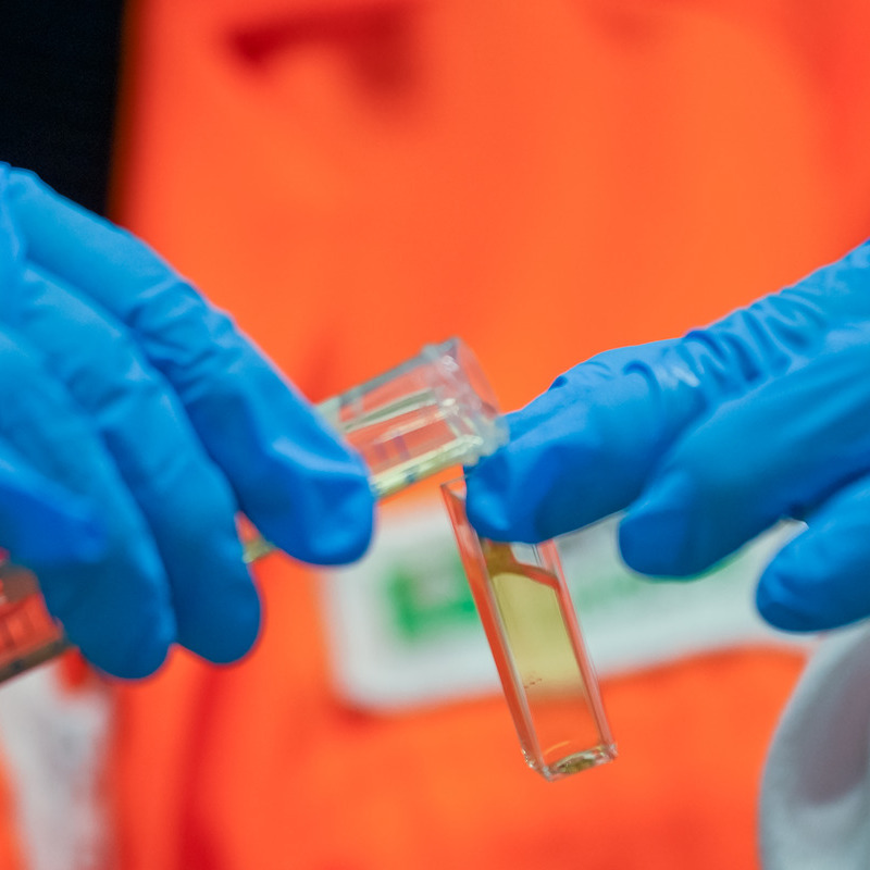 Clover honey being poured in a test tube