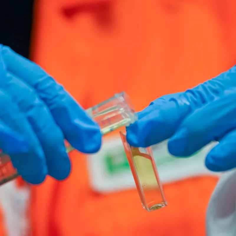 Clover honey being poured in a test tube