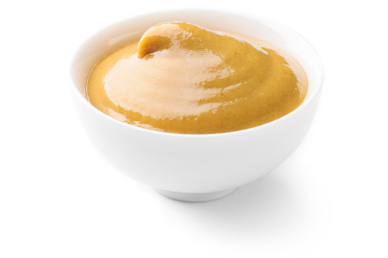 Manuka honey in a small white bowl