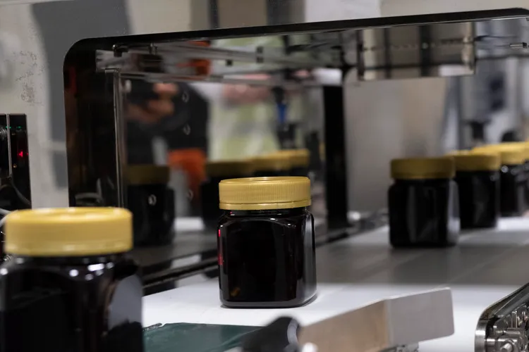 Private label manuka honey running through production line