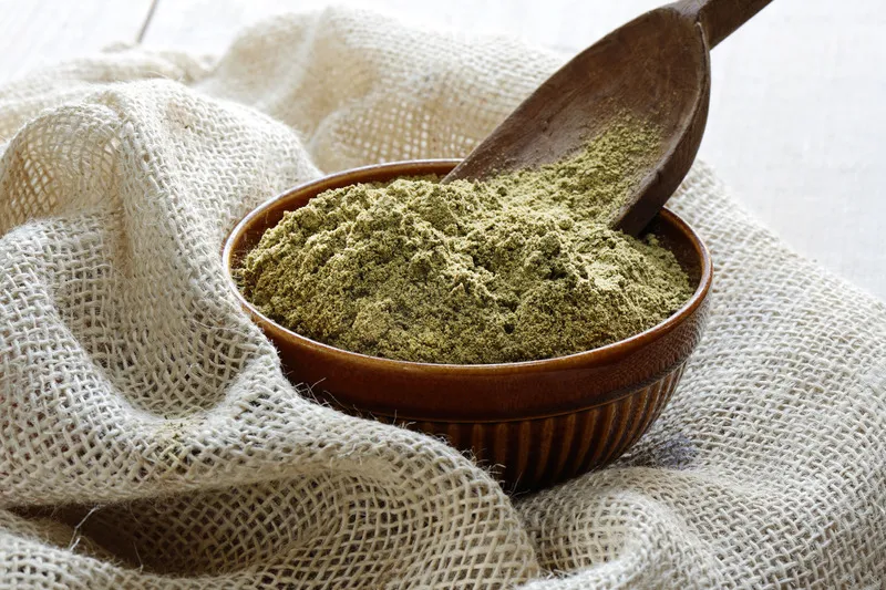 Hemp Seed Flour in bowl bowl with wooden scoop
