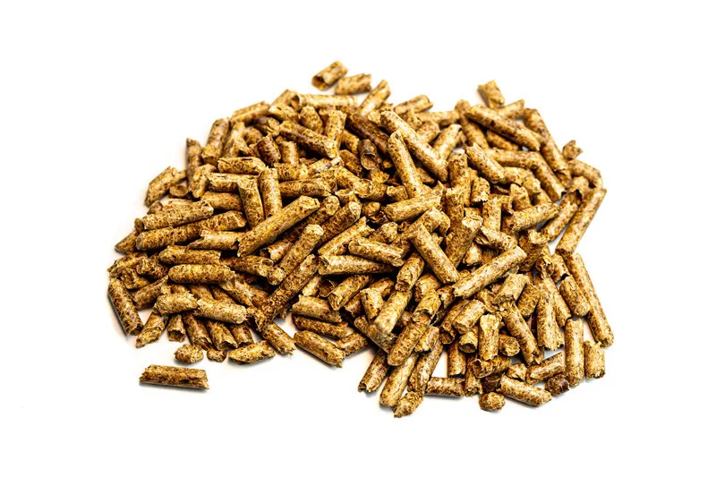 Flaxseed meal in a pile on white background