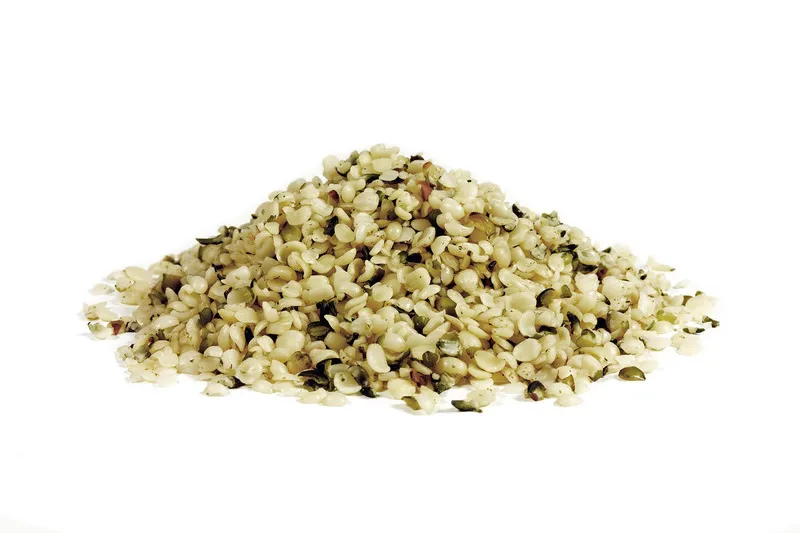 Hulled Hemp Seeds in a pile on a white background
