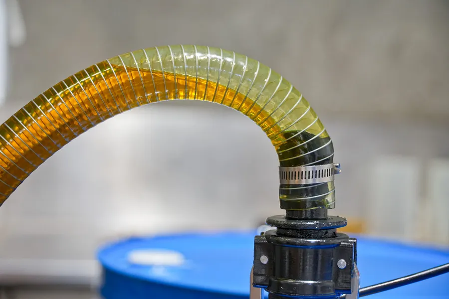 Flaxseed Oil being filtered into a drum